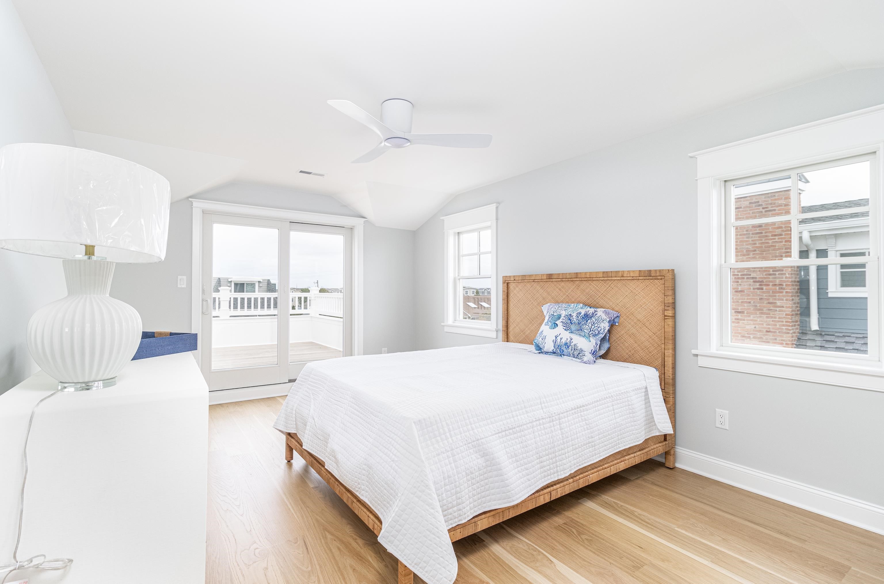 188 33rd Avalon, NJ 08202 - Photo 29 of 36 a bedroom with a large bed and a window