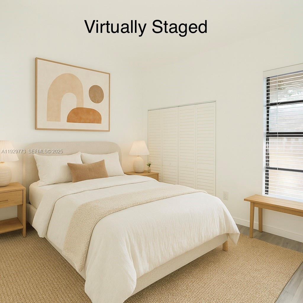 6725 Northwest 192nd Lane Hialeah, FL 33015 - Photo 13 of 29 a bedroom with a bed and a window