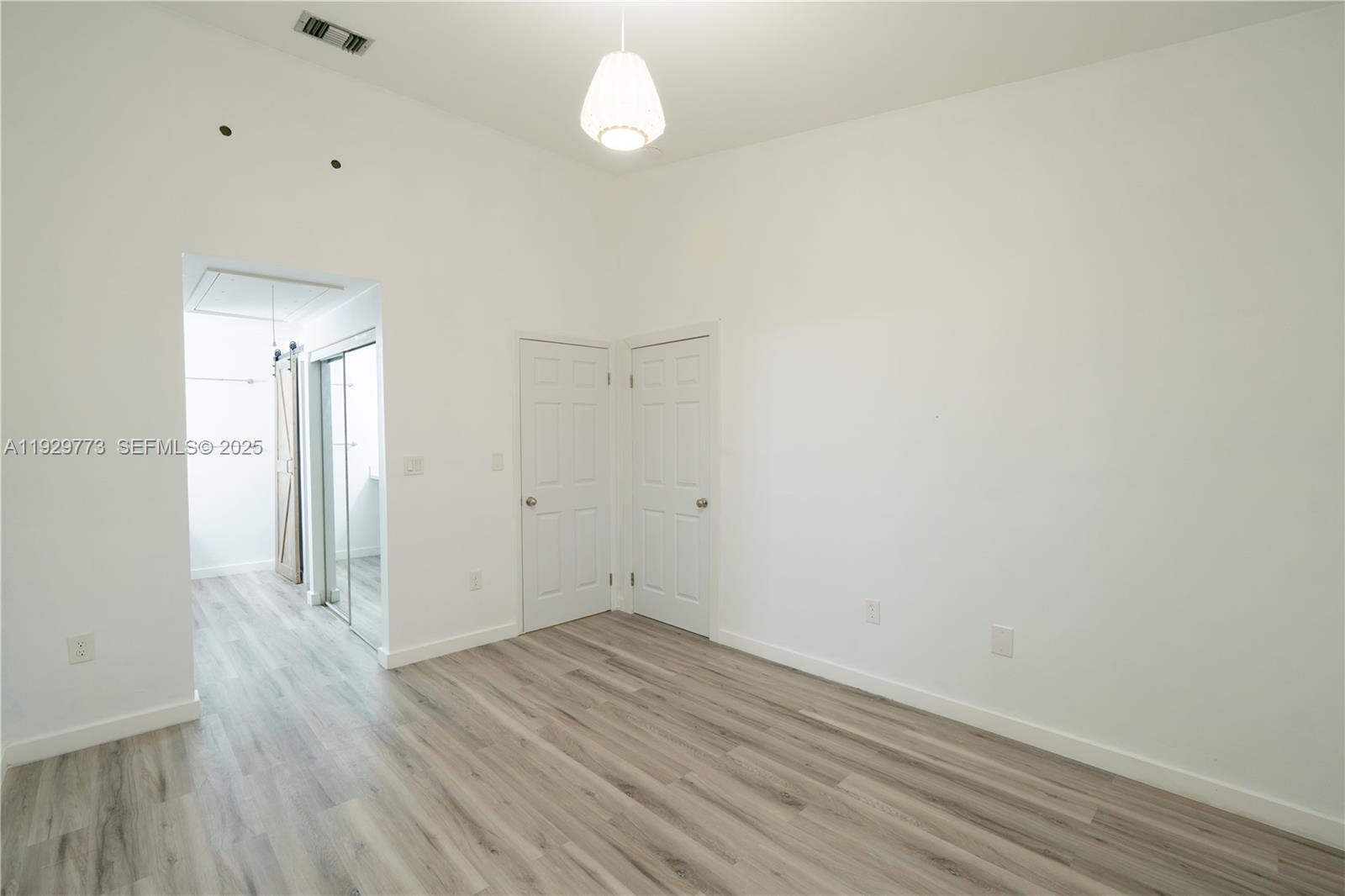 6725 Northwest 192nd Lane Hialeah, FL 33015 - Photo 19 of 29 a view of a room with wooden floor