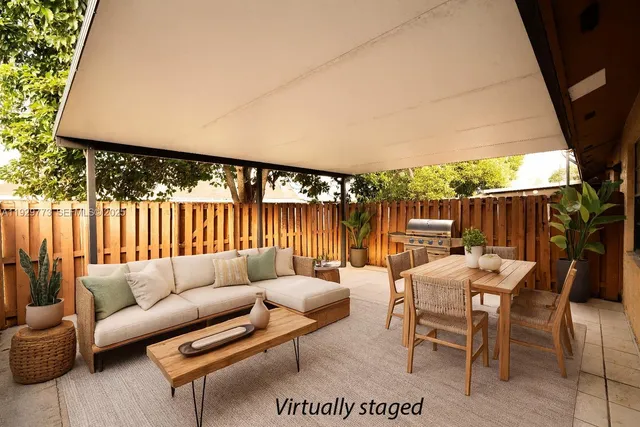 a patio with patio a couch and chairs