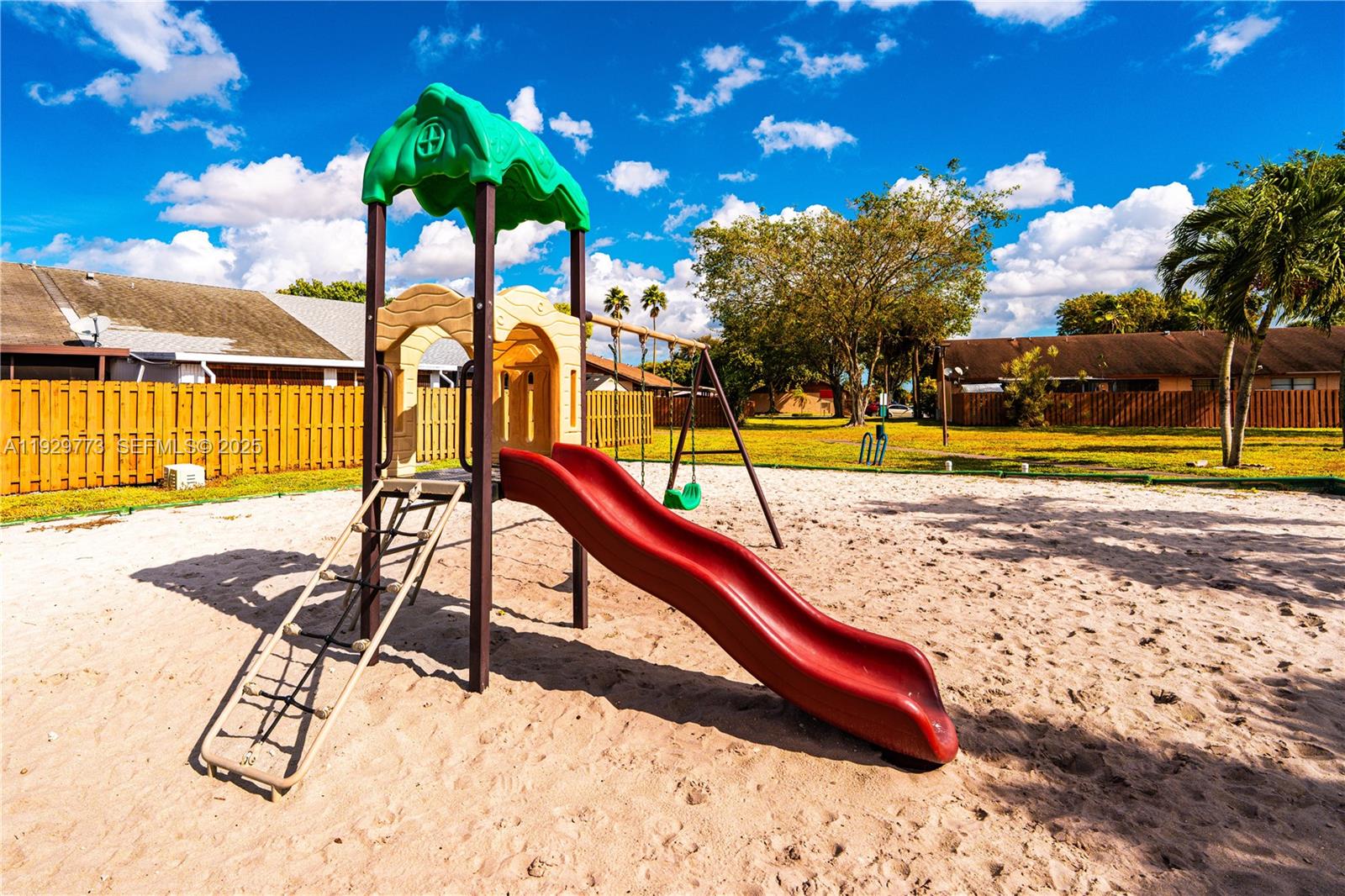 6725 Northwest 192nd Lane Hialeah, FL 33015 - Photo 29 of 29 a view of swimming pool with lounge chair and dinning tables