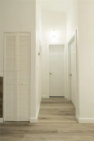a view of a bathroom with wooden floor