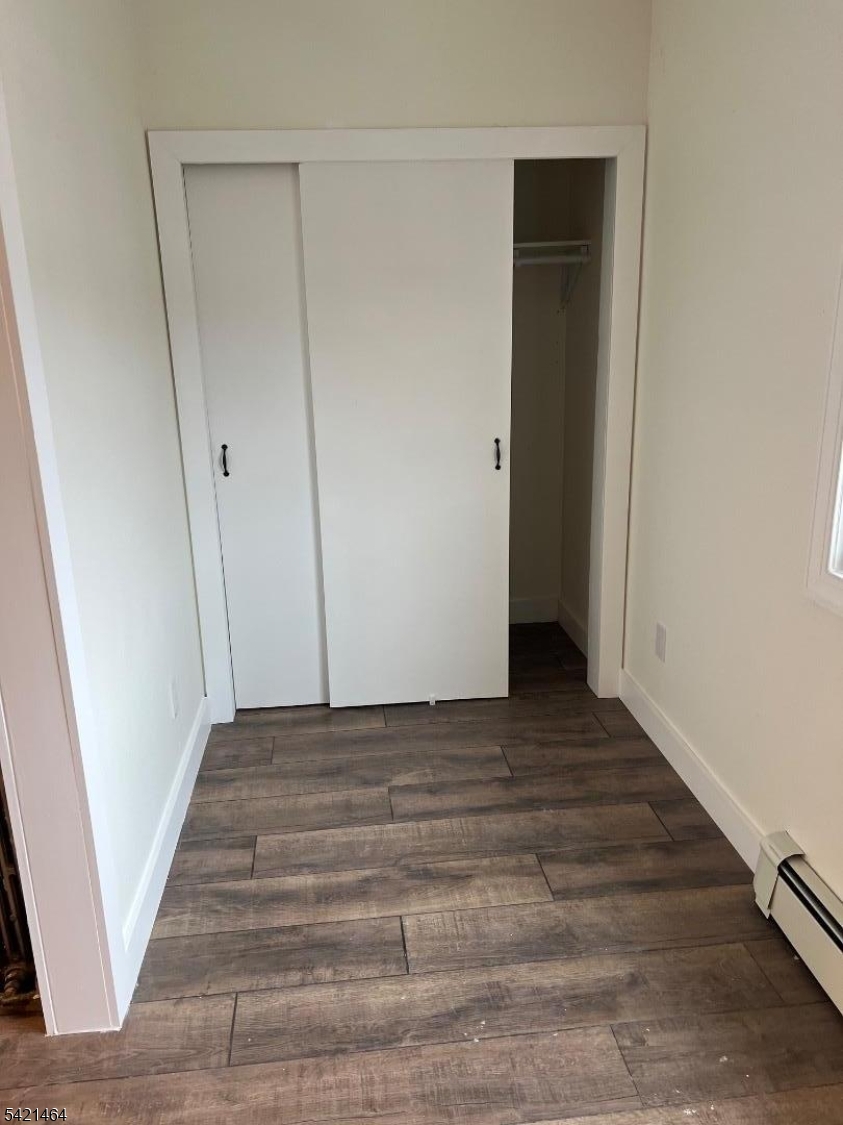 227 Palmer Street, Unit 2 Elizabeth, NJ 07202 - Photo 12 of 13 a view of a hallway with wooden floor