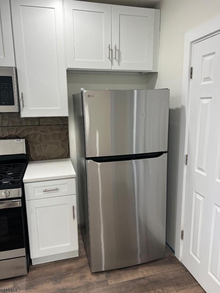 227 Palmer Street, Unit 2 Elizabeth, NJ 07202 - Photo 2 of 13 a utility room with dryer and washer