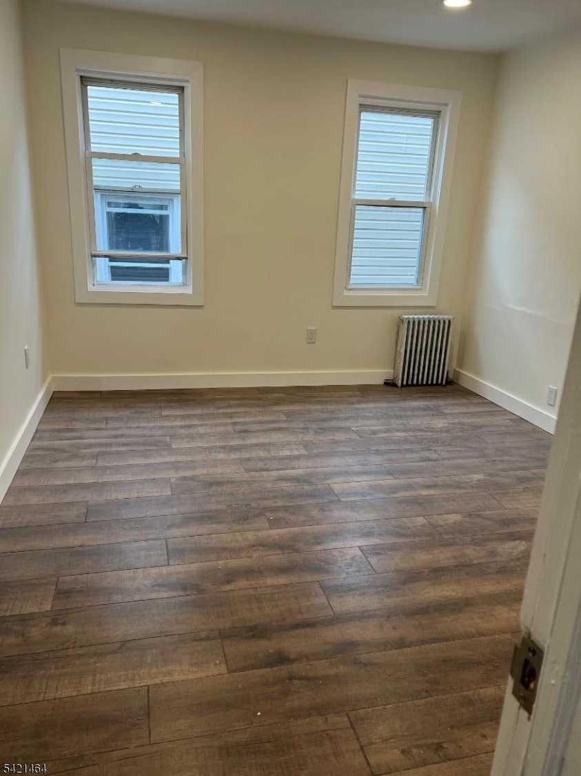 227 Palmer Street, Unit 2 Elizabeth, NJ 07202 - Photo 9 of 13 a view of an empty room with a window