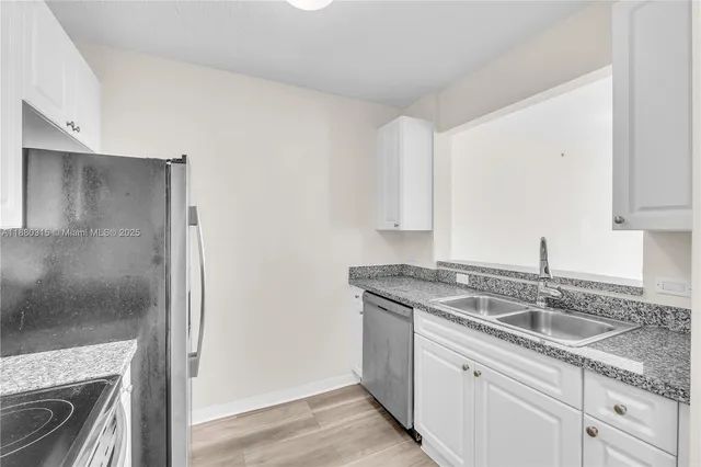 a kitchen with a stove microwave and refrigerator