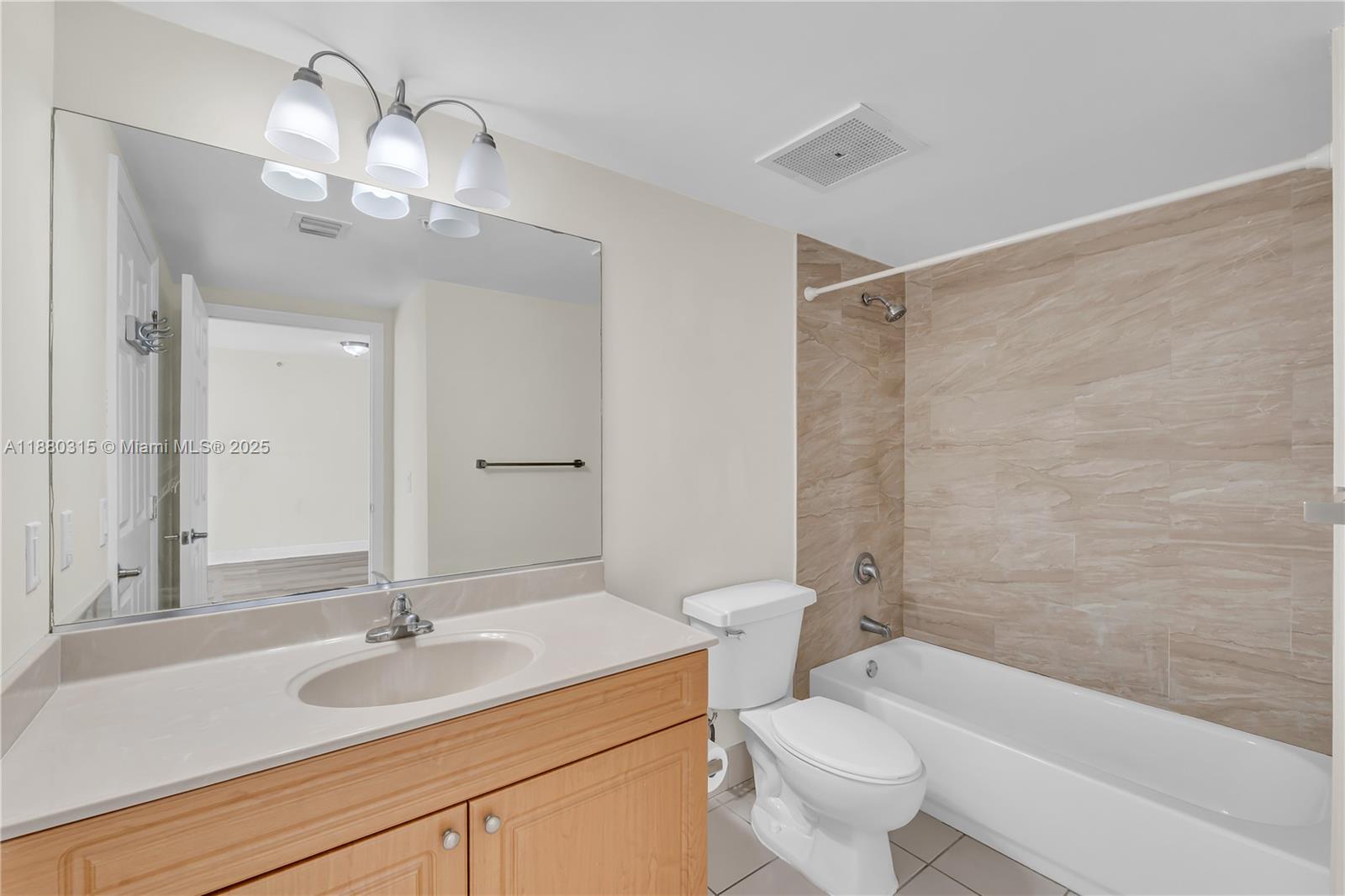 900 Southwest 8th Street, Unit 1110 Miami, FL 33130 - Photo 17 of 27 a bathroom with a sink a toilet and shower