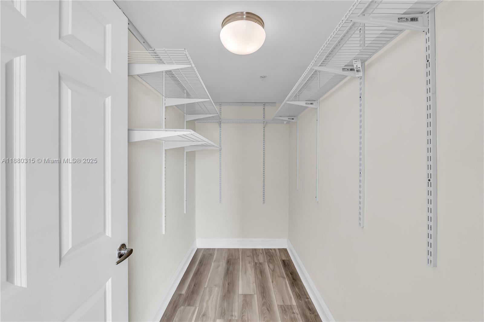 900 Southwest 8th Street, Unit 1110 Miami, FL 33130 - Photo 21 of 27 a view of a hallway with wooden floor