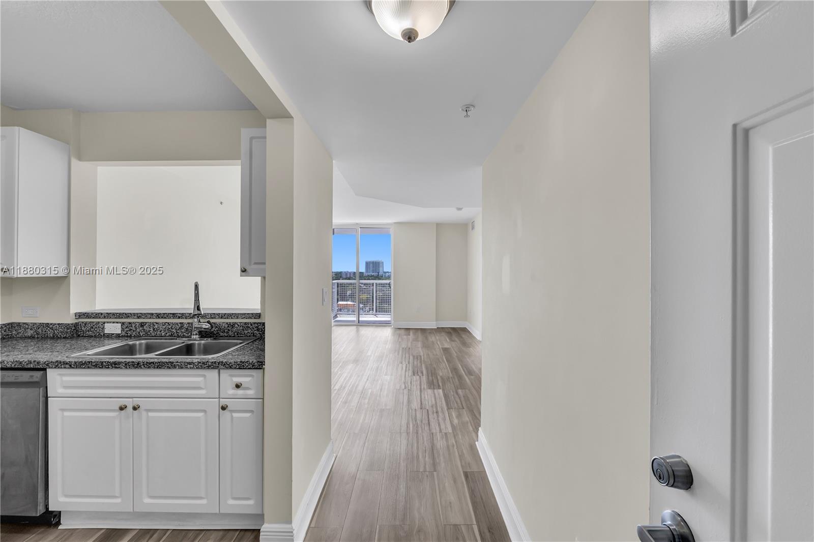 900 Southwest 8th Street, Unit 1110 Miami, FL 33130 - Photo 7 of 27 a view of kitchen with wooden floor