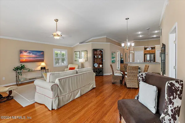 a living room with fireplace furniture and a wooden floor