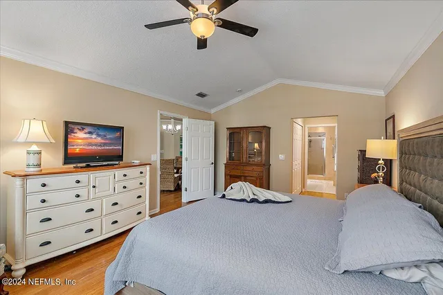a spacious bathroom with a granite countertop sink mirror and shower