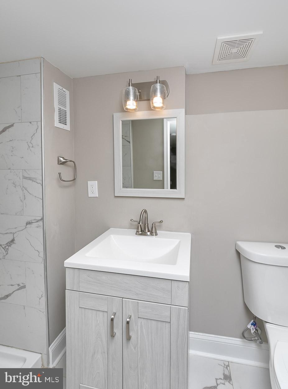 404 Upland Road Pikesville, MD 21208 - Photo 32 of 34 Full Bath with trendy fixtures and new vanity.