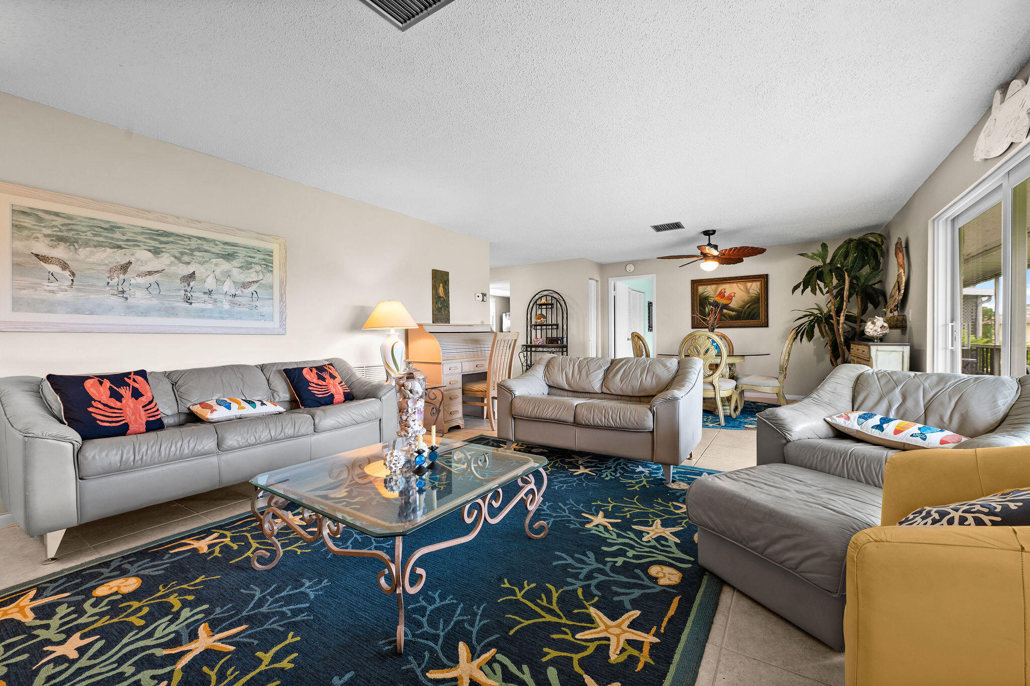 355 Palm Drive, Unit 2 Naples, FL 34112 - Photo 11 of 30 a living room with furniture and a rug
