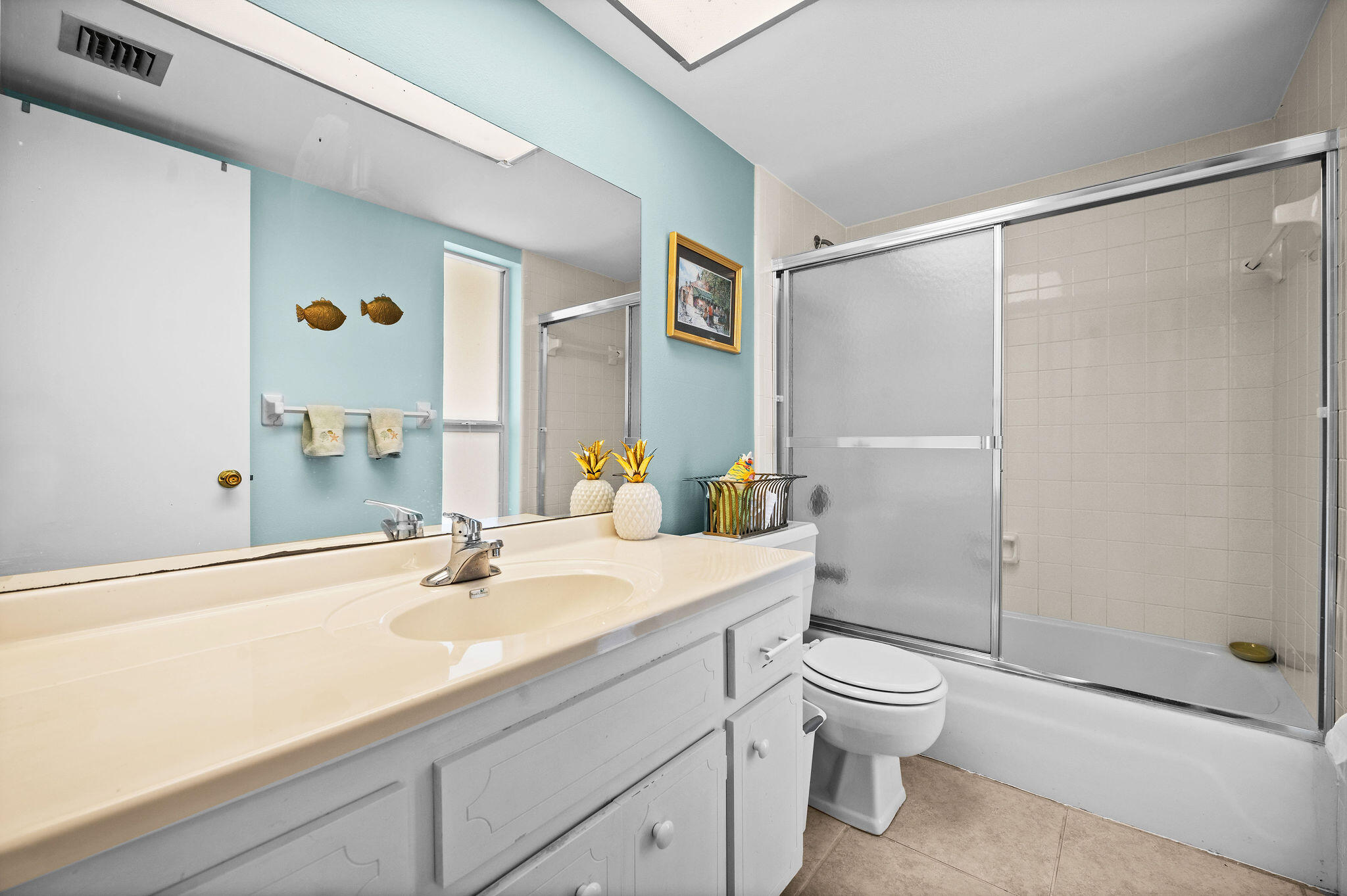 355 Palm Drive, Unit 2 Naples, FL 34112 - Photo 15 of 30 a bathroom with a sink a toilet and shower