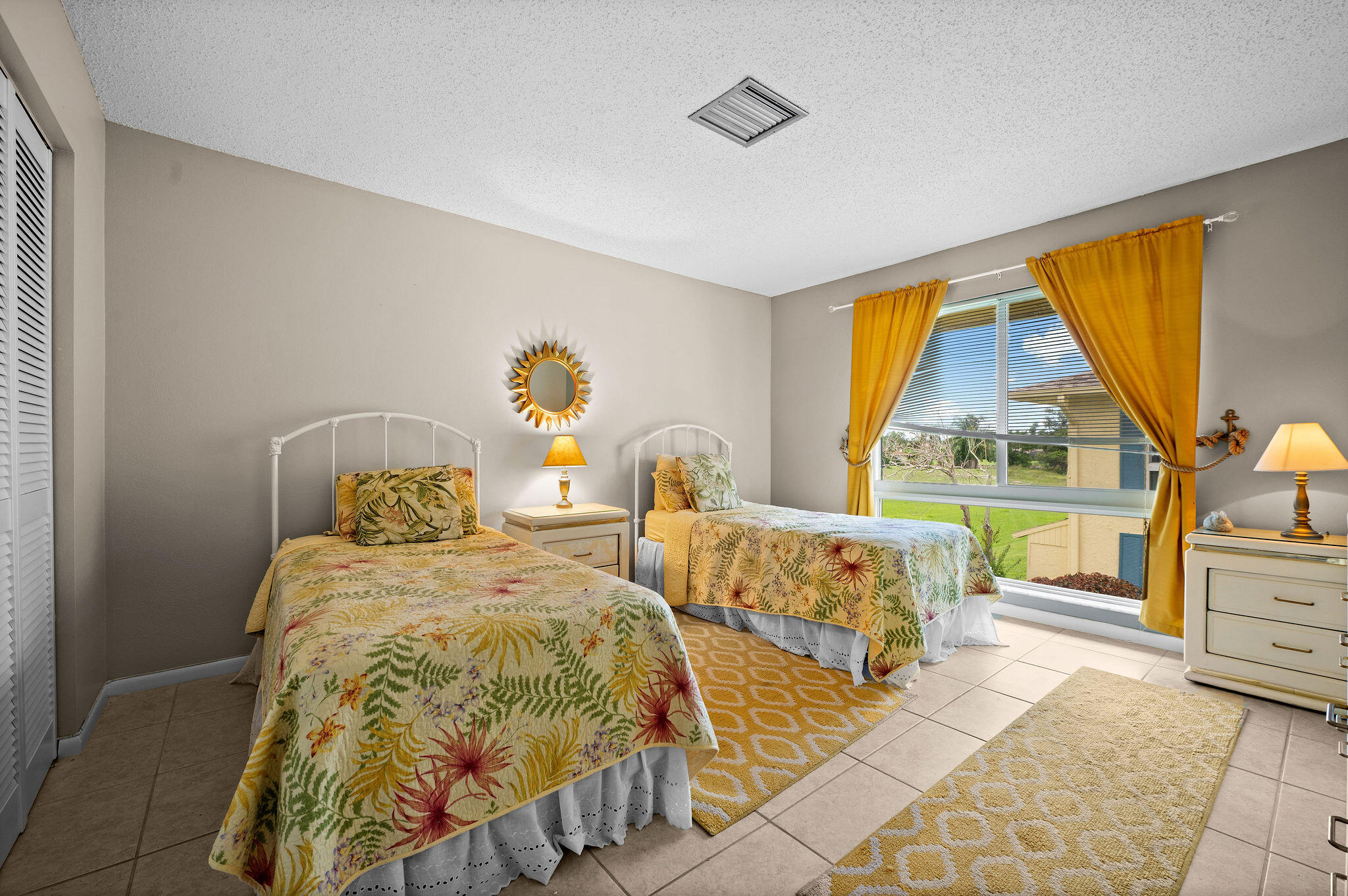 355 Palm Drive, Unit 2 Naples, FL 34112 - Photo 16 of 30 a bedroom with two beds and a window