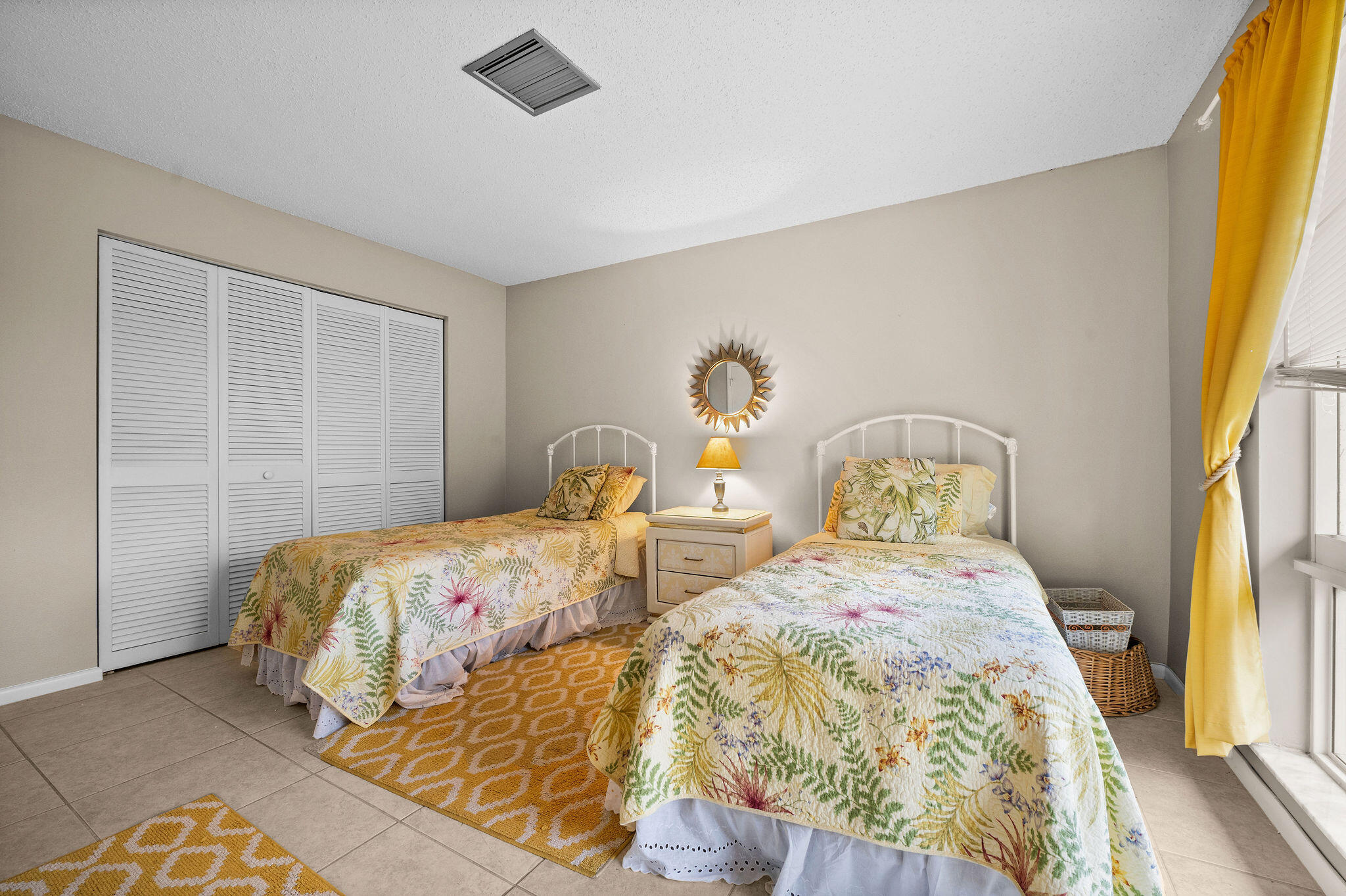 355 Palm Drive, Unit 2 Naples, FL 34112 - Photo 17 of 30 a bedroom with two beds and next to a window