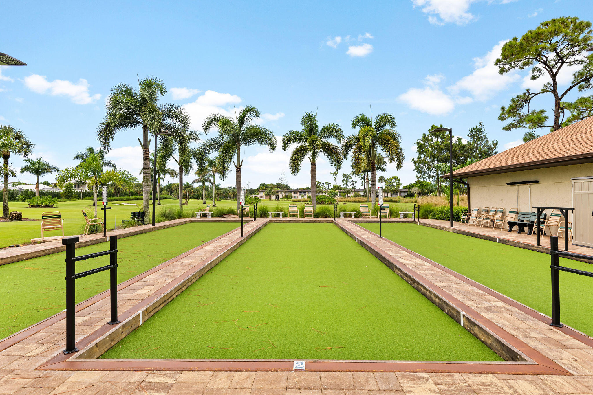355 Palm Drive, Unit 2 Naples, FL 34112 - Photo 24 of 30 a view of swimming pool with outdoor seating