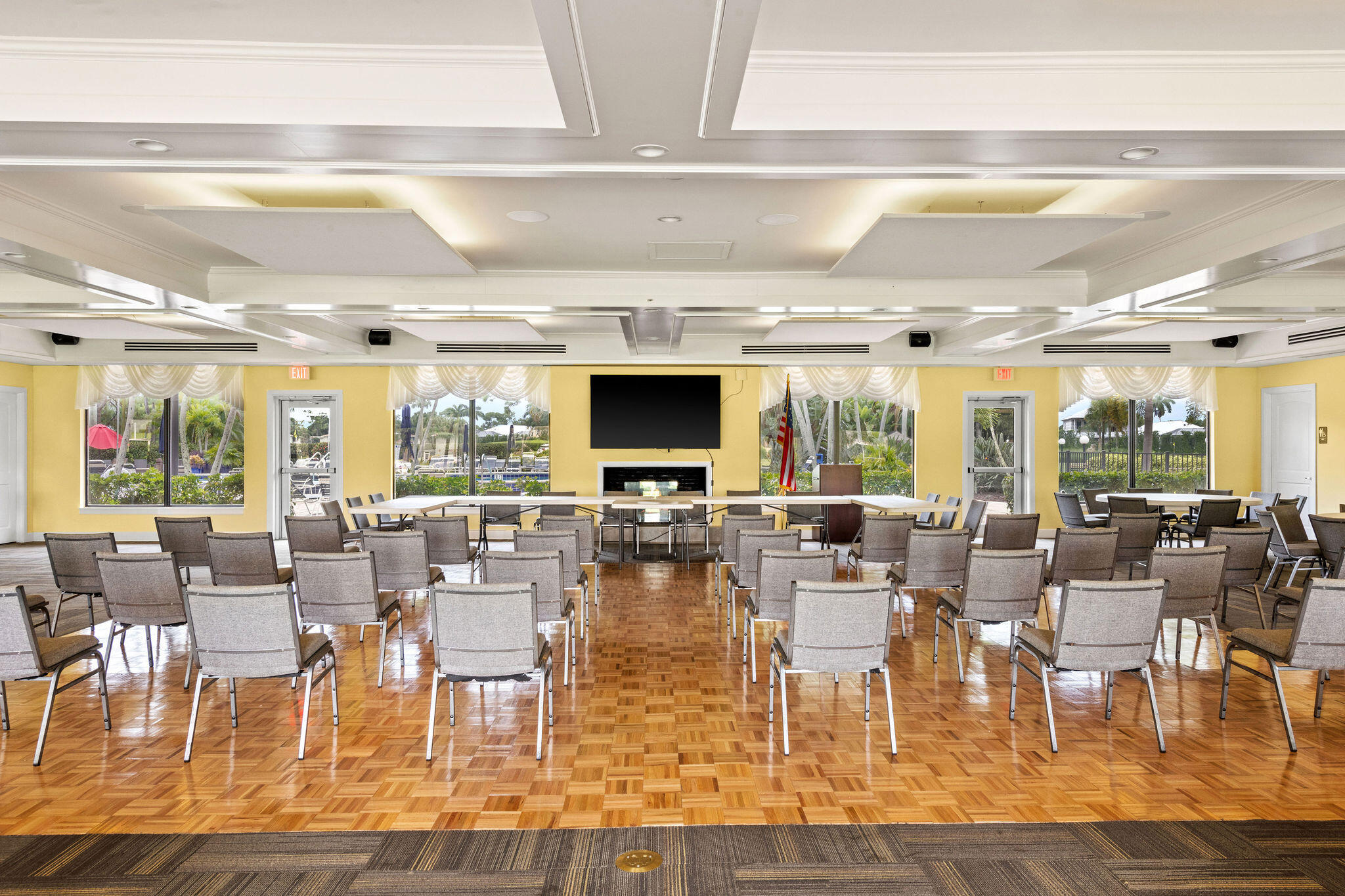355 Palm Drive, Unit 2 Naples, FL 34112 - Photo 25 of 30 a living room with lots of furniture and a flat screen tv
