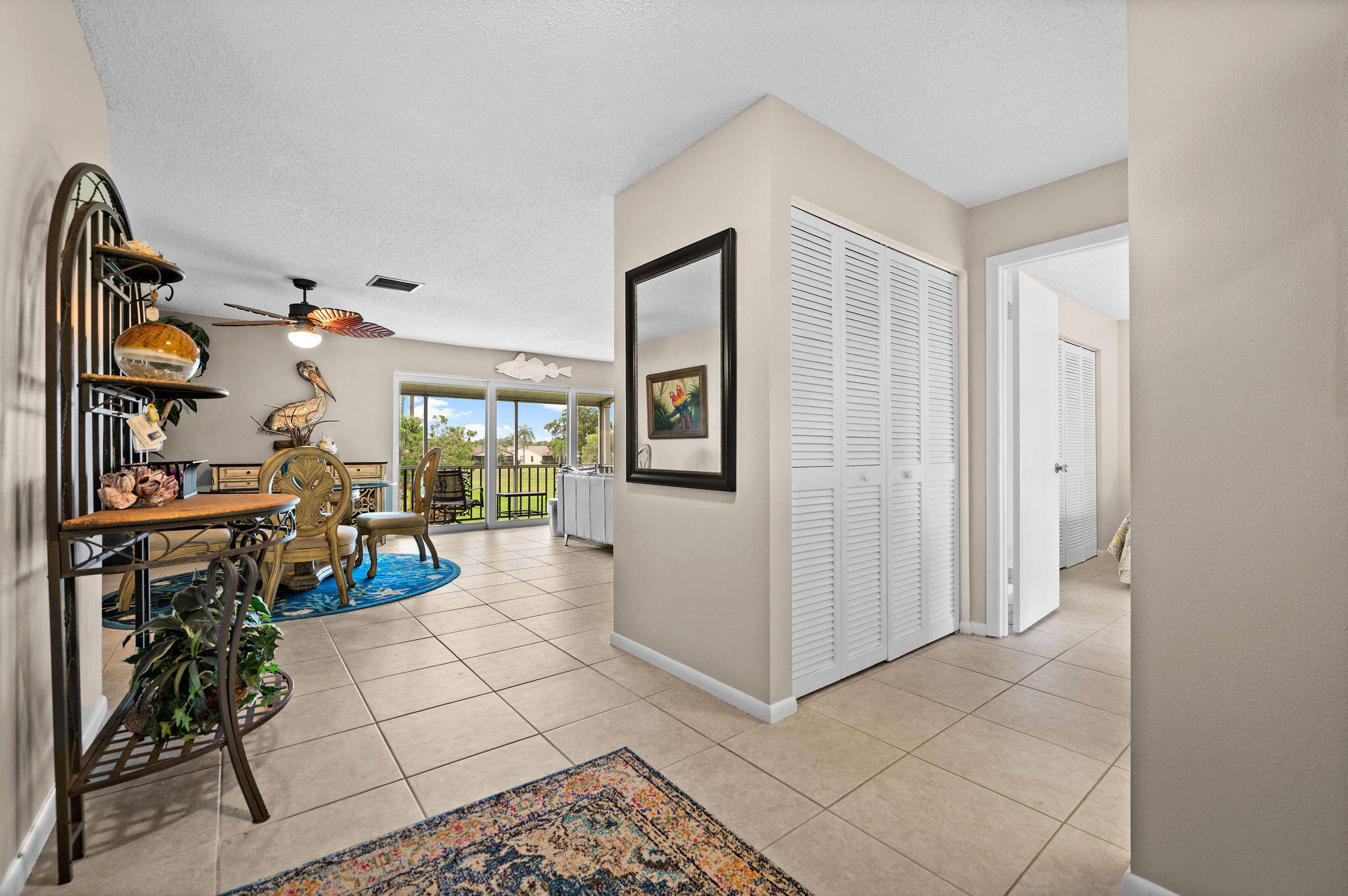 355 Palm Drive, Unit 2 Naples, FL 34112 - Photo 3 of 30 a very nice looking room with many windows