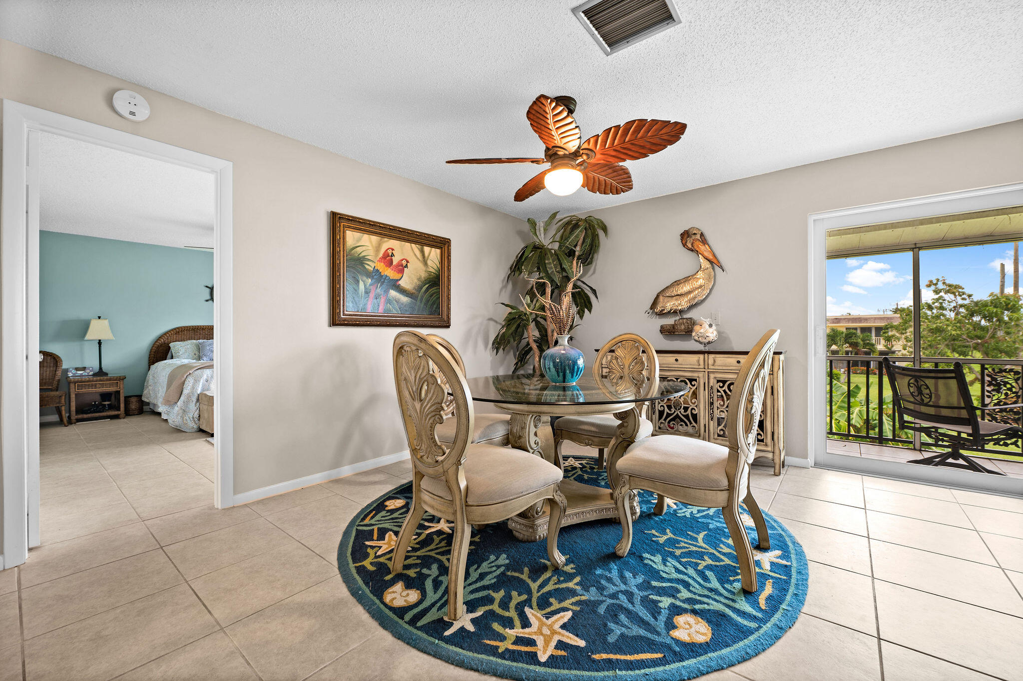 355 Palm Drive, Unit 2 Naples, FL 34112 - Photo 4 of 30 a living room with furniture a couch and a chandelier