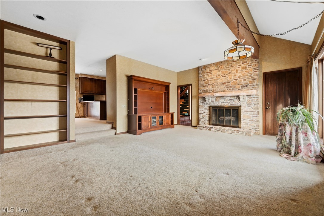 7014 River Styx Road Medina, OH 44256 - Photo 10 of 49 Unfurnished living room featuring a large fireplace and light carpet