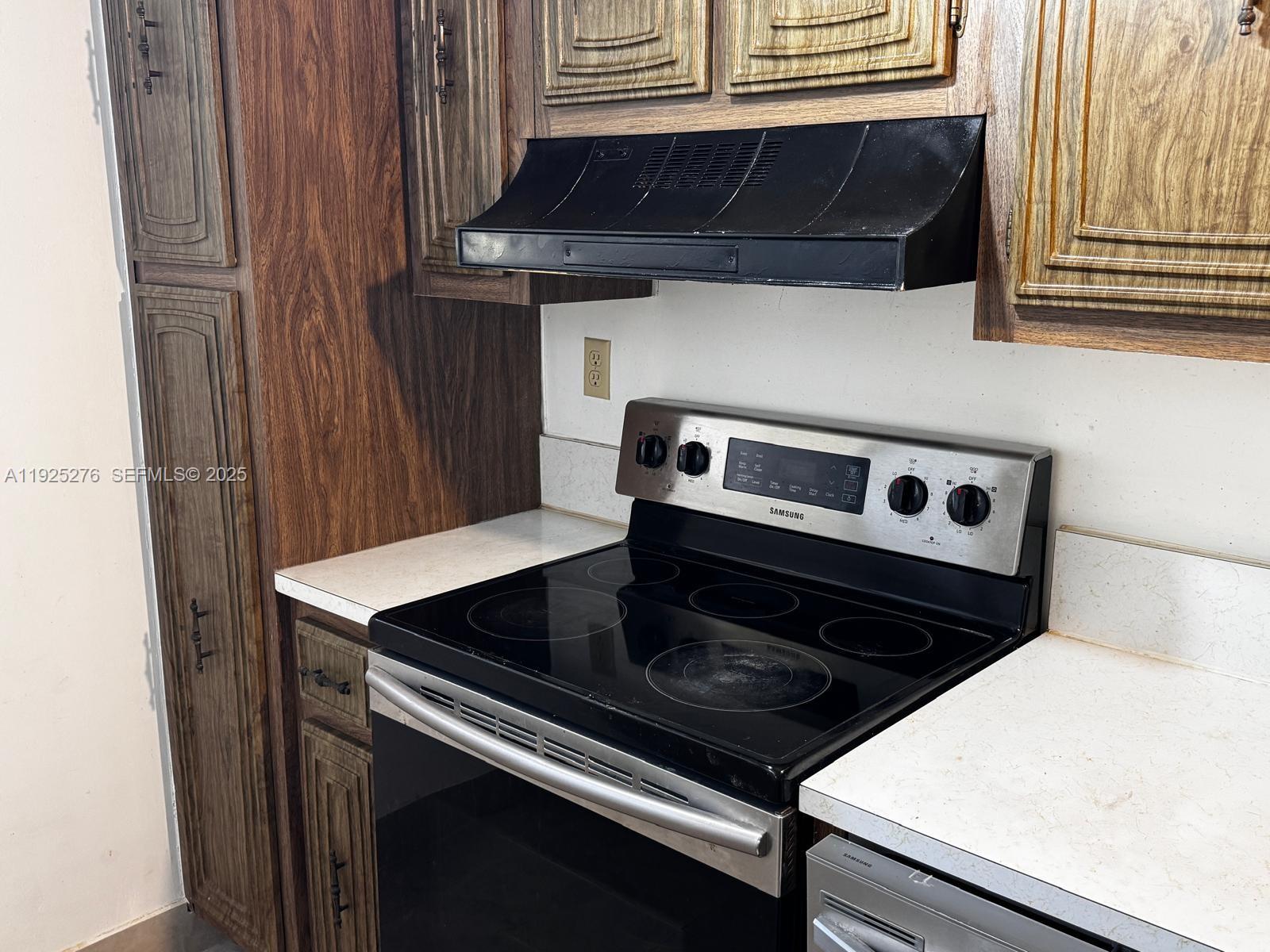 3671 Environ Boulevard, Unit 369 Lauderhill, FL 33319 - Photo 12 of 21 a close view of kitchen stove and microwave