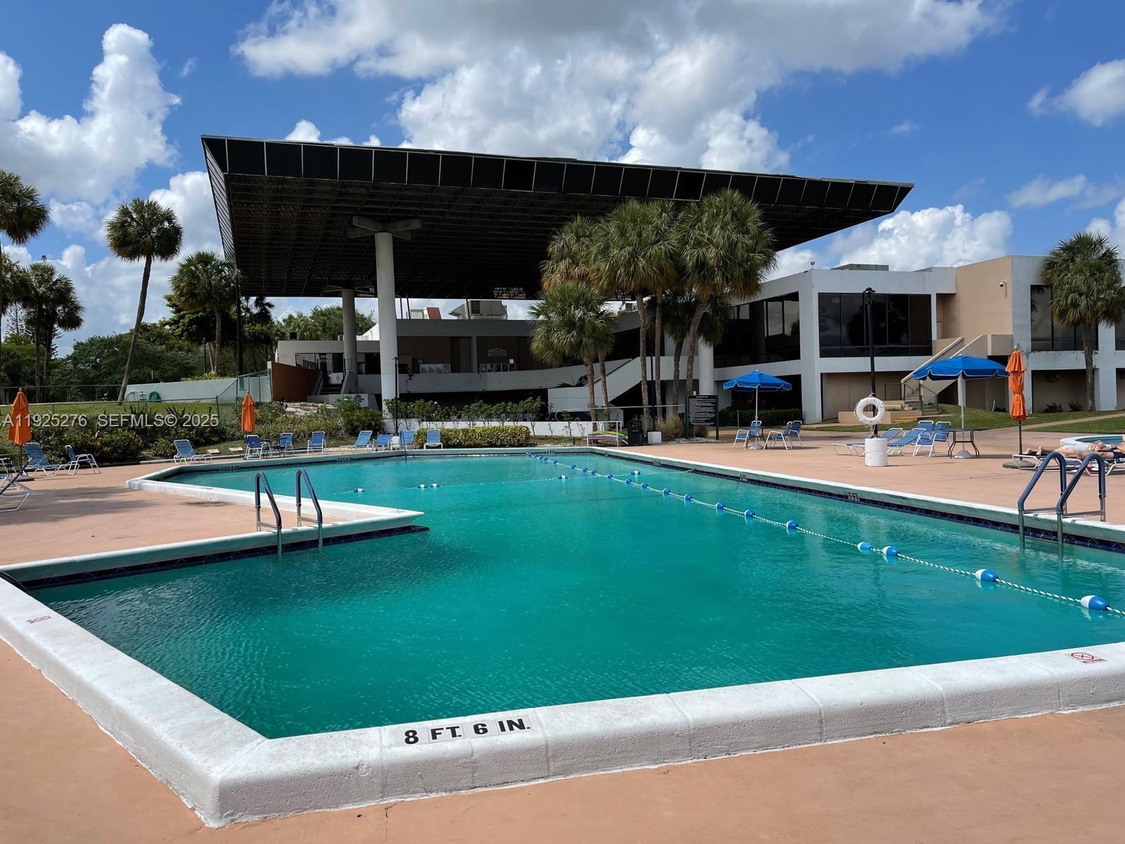 3671 Environ Boulevard, Unit 369 Lauderhill, FL 33319 - Photo 18 of 21 a house view with swimming pool and sitting space