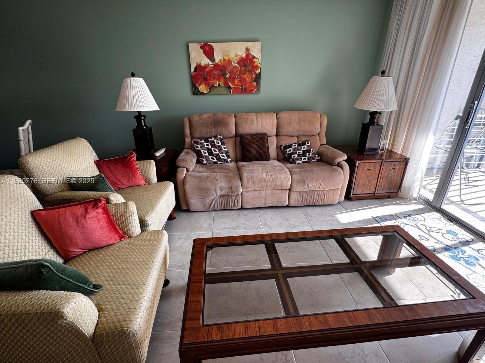3671 Environ Boulevard, Unit 369 Lauderhill, FL 33319 - Photo 2 of 21 a living room with furniture and a window