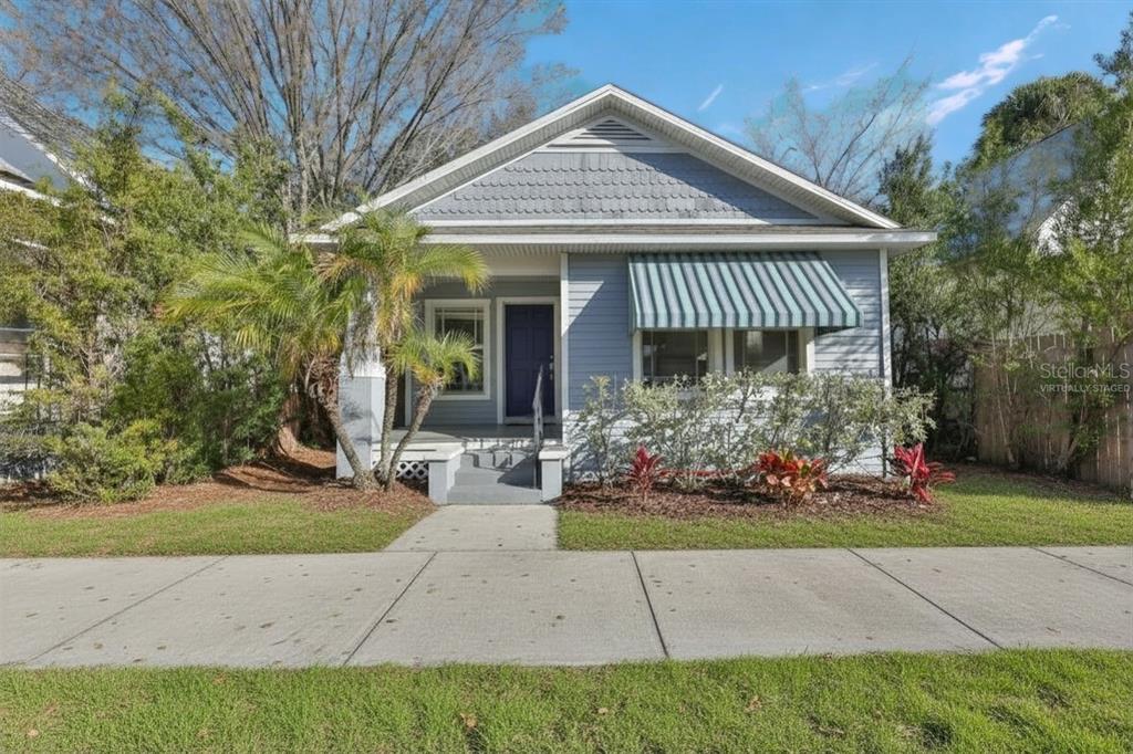 2331 West Chestnut Street Tampa, FL 33607 - Photo 1 of 33 a front view of a house with garden