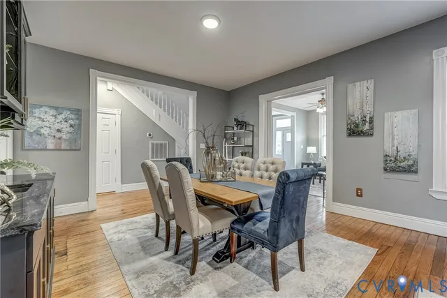 a kitchen with kitchen island granite countertop a sink cabinets and stainless steel appliances