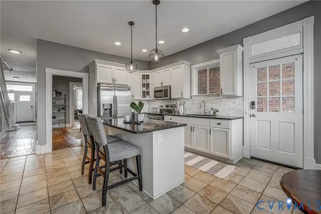 a spacious bedroom with a bed and a table in it