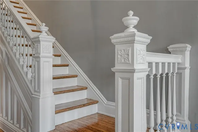 a view of a livingroom with furniture and staircase