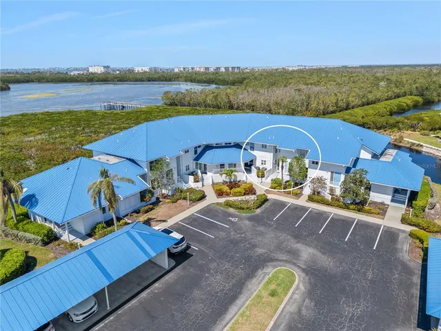 an aerial view of a house with outdoor space patio swimming pool and outdoor seating