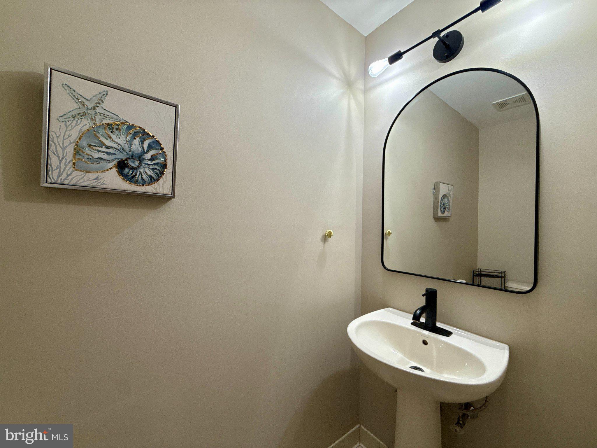 267 Flagstone Road, Unit 6 Chester Springs, PA 19425 - Photo 11 of 27 Chic powder room with coastal accents.