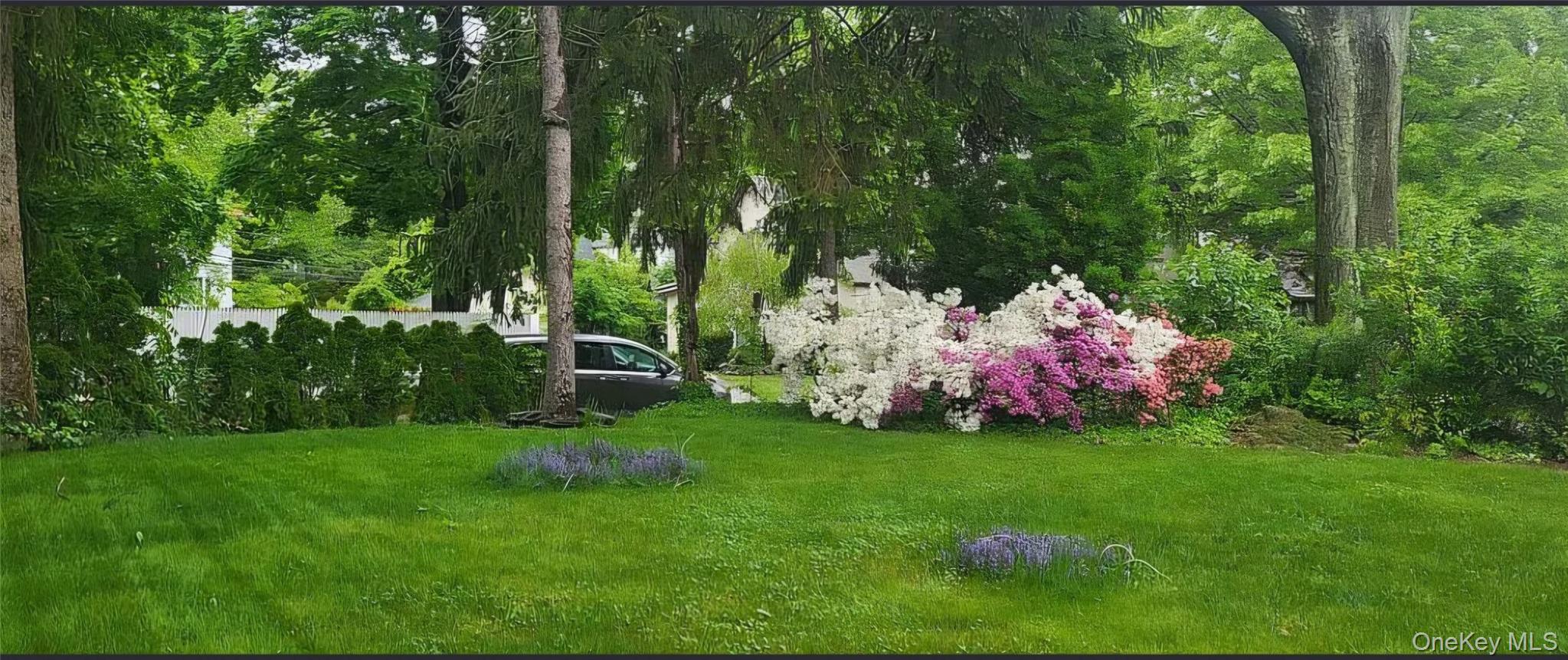 257 Schenck Avenue Great Neck, NY 11021 - Photo 3 of 9 a garden view with a seating space