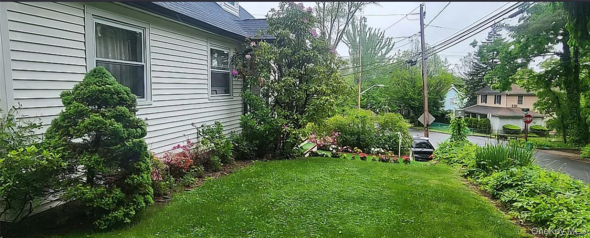 257 Schenck Avenue Great Neck, NY 11021 - Photo 4 of 9 a view of a house with a backyard