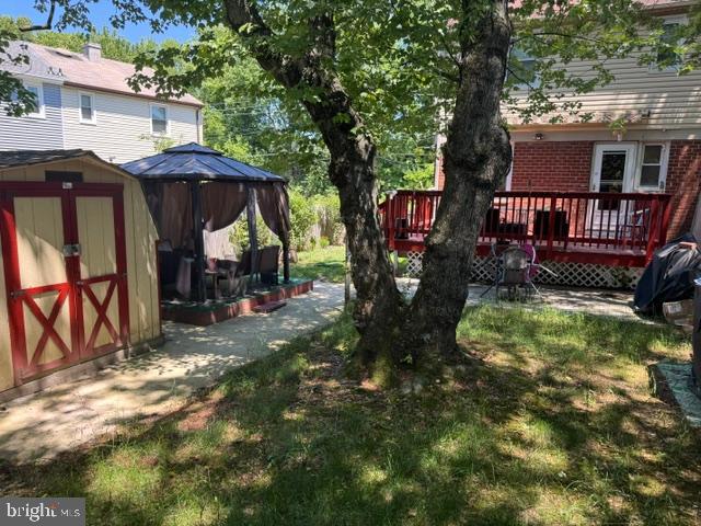 4603 Raleigh Road Temple Hills, MD 20748 - Photo 22 of 40 a view of a house with backyard and sitting area