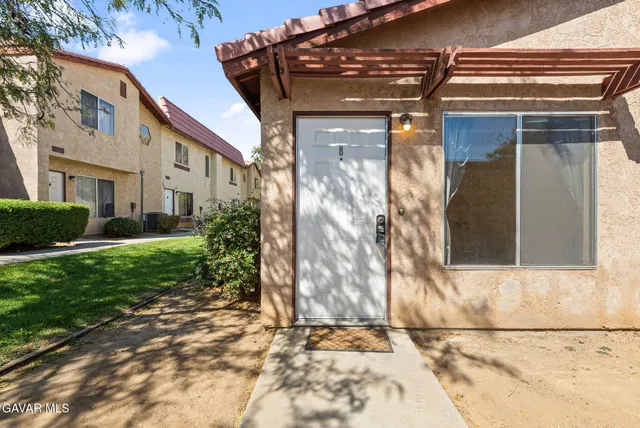 a side view of a house with a yard
