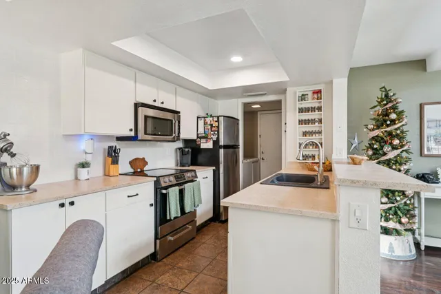 a kitchen with a stove and a microwave