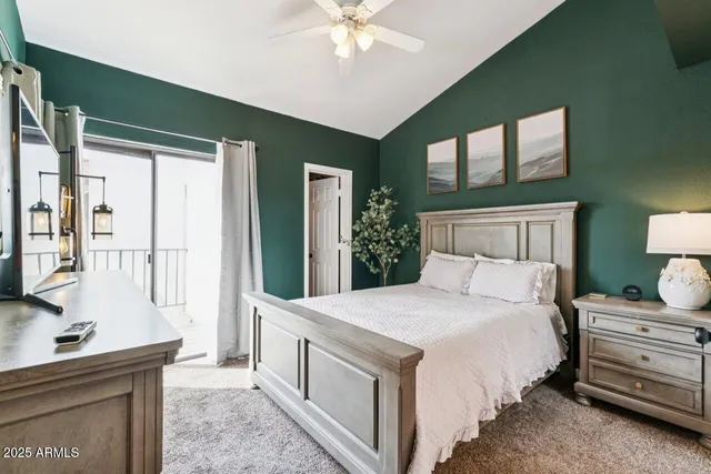 a bedroom with a large bed and a dresser