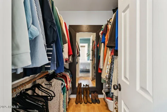 a bathroom with double vanity sink and a mirror