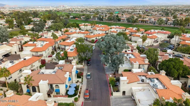 an aerial view of residential houses with outdoor space