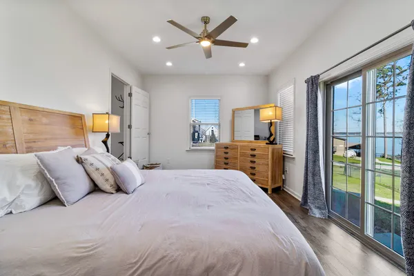 a bedroom with a bed and a view of bedroom