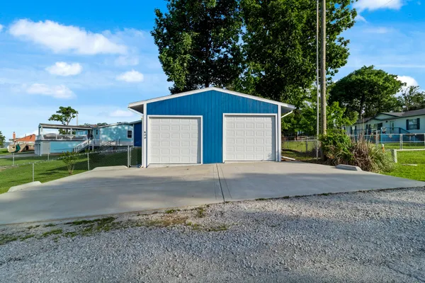 a view of an entrance to house with yard
