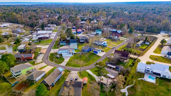 a group of people sitting in a yard