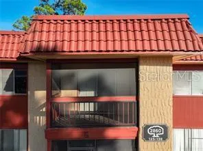 a view of a brick house with a large window