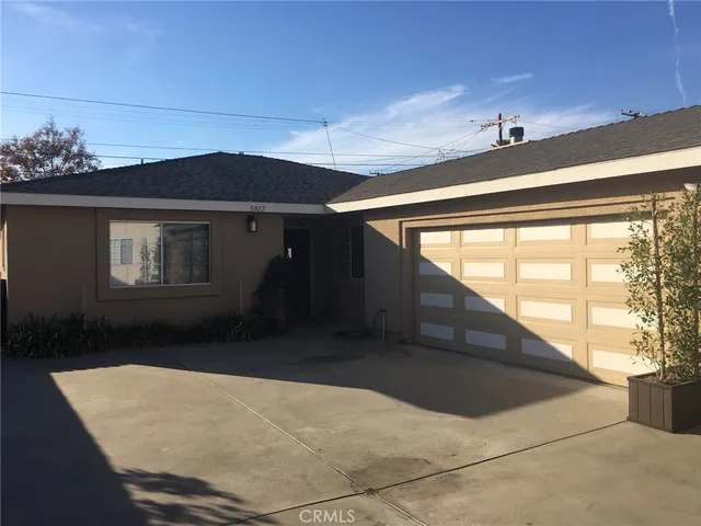 a kitchen with a stove a sink and a window