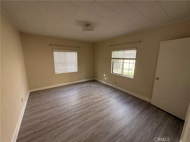 a bathroom with a sink a toilet a mirror and shower