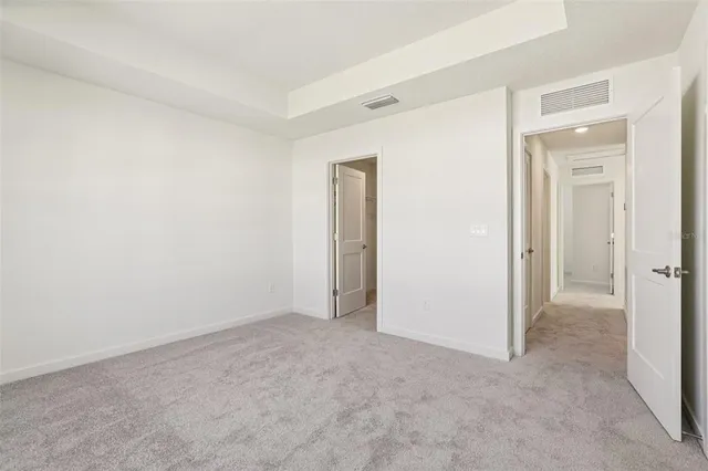 an empty room with closet area