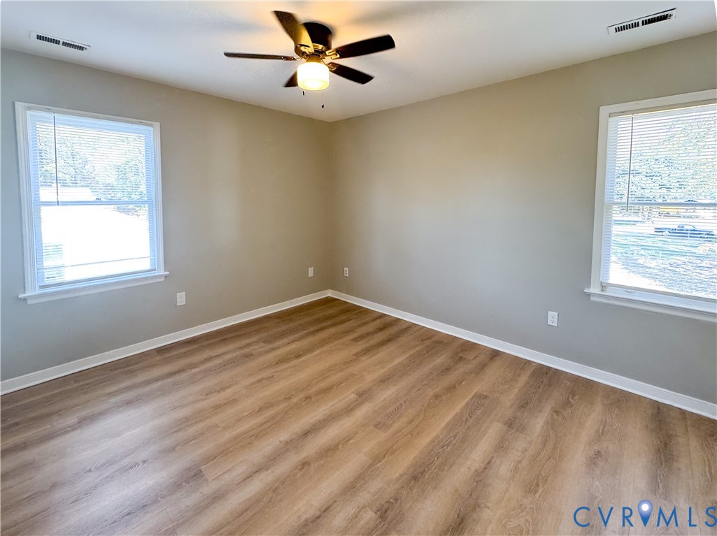 1706 Hungary Road Henrico, VA 23228 - Photo 12 of 28 a view of empty room with wooden floor and fan
